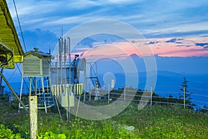 Weather station in sunset mountain landscape