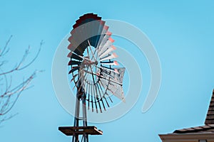 Weather vane blowing in the wind at the Michigan farm garden at the Frederik Meijer Gardens