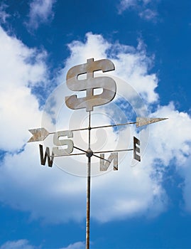 Weather vane with dollar symbol photo