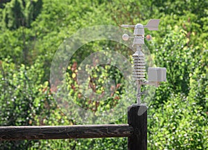 Weather vane marking the direction of the wind and anemometer (wind speed meter)