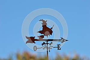 Weather vane with a witch flying with broom