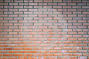 The weather worn red brick wall texture. Fire brick wall