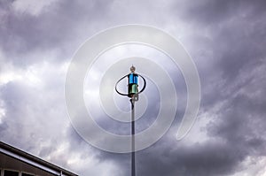 Weathercock of weather station against dramatical twilight sky photo