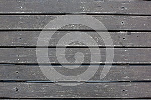 weatherd wood lath line arrange pattern textrue background.Texture of dark untreated wood