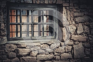 Weathered Abandoned Building Exterior with Damaged Walls and Old Windows. Place of imprisonment, Prison with the old window