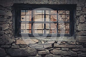 Weathered Abandoned Building Exterior with Damaged Walls and Old Windows. Place of imprisonment, Prison with the old window