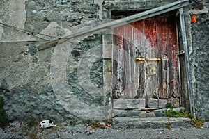 Weathered ancient door on abandoned building