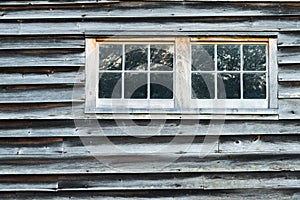 Weathered Barn Wall with Overlapped Wood Siding with Two Windows