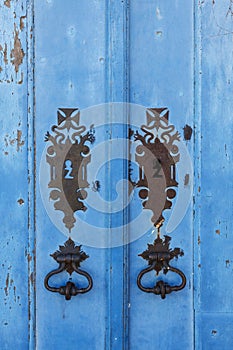 Weathered blue door of the Igreja de Nossa Senhora das Merces e da Misericordia church in Ouro Preto, Minas Gerais, Brazil photo