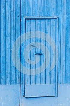 Weathered blue wood warehouse door pattern and texture for background