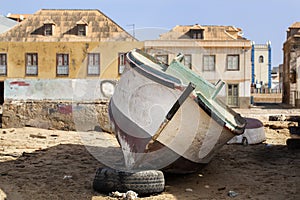 Weathered boat parked on the beach of Sal Rei on Boa Vista