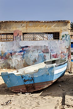 Weathered boat parked on the beach of Sal Rei on Boa Vista