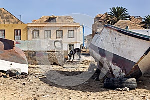 Weathered boats parked on the beach of Sal Rei on Boa Vista