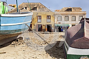 Weathered boats parked on the sand of Sal Rei on Boa Vista