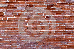 Weathered brick wall background in red tone. Abstract background and pattern
