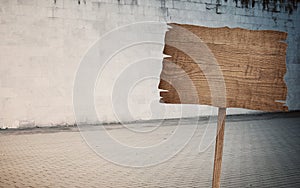 Weathered cinder block, brick wall texture, wood sign and walkway