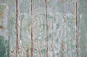 Weathered colored wooden boards with peeling off color
