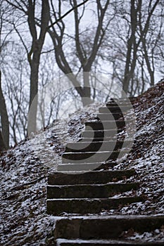 Weathered concrete steps leading up a hill. Trakai, Lithuania.
