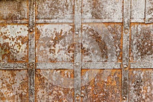 Weathered cross steel metallic texture elements of the old door