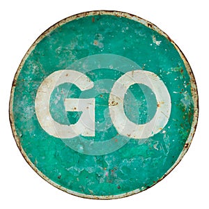 Weathered damaged green road sign with the text go