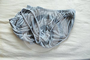 Weathered and decayed dirty underwear for men