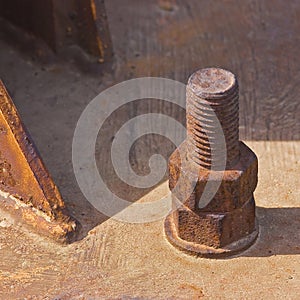 Weathered and decaying metal framework with rust-encrusted bolts and nuts - Old rusty iron structure