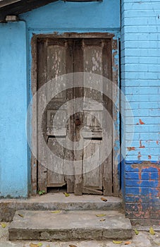 Weathered door in an old house in Kumrokhali, India