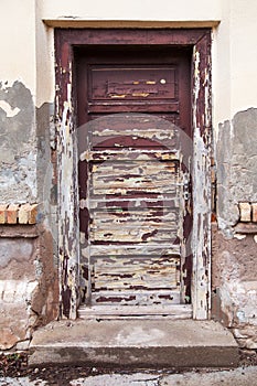 Weathered door with peeling paint