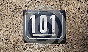 Weathered enameled plate number 101