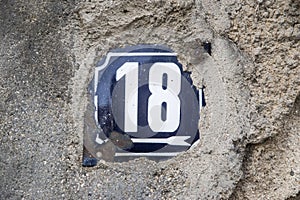 Weathered enameled plate number 18