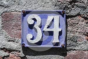 Weathered enameled plate number 34