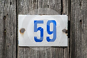 Weathered enameled plate number 59