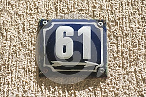 Weathered enameled plate number 61