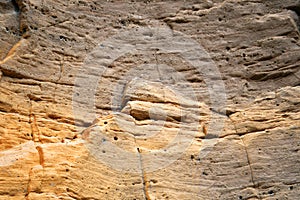 Weathered eroded yellow rock surface