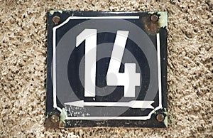 Weathered enameled plate number 14 photo