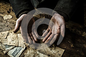 Weathered Hands on Wooden Table