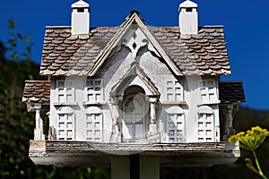 Weathered Large Wooden Bird House With Blue Sky