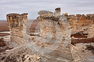 Weathered limestone pillars and vertical rock face