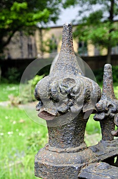 Weathered metal fence finials