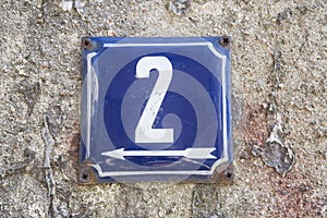 Weathered metal plate of number of street address number 2