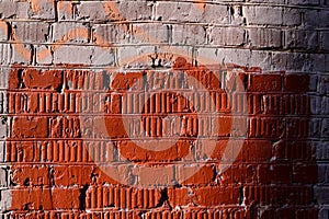 Weathered old brick wall painted brown paint. Abstract background