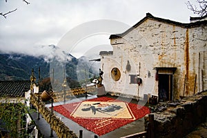 Weathered old building in Huangling, Wuyuan, Jiangxi during a rainy day