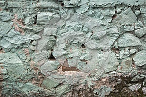 Weathered old house stone wall closeup