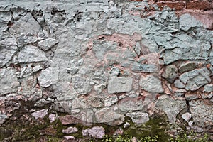 Weathered old house stone wall closeup