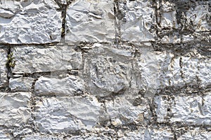 Weathered old sandstone and granite wall