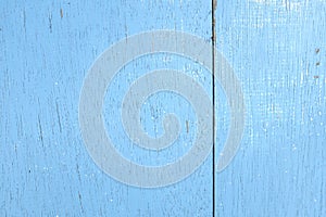 Weathered old wooden background with light sky blue paint. Wood texture pattern.