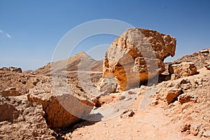 Weathered orange rocks in desert