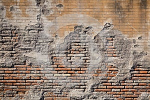 Weathered plaster and brick wall textured background