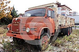 Weathered red retro rusty truck.