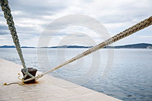 Weathered ropes attached to the pier